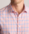 Model is wearing UNTUCKit Performance Whitman Shirt in Pink & Blue Plaid.