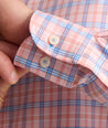 Model is wearing UNTUCKit Performance Whitman Shirt in Pink & Blue Plaid.