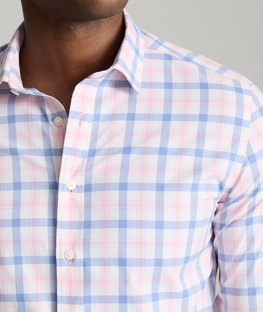 Model is wearing UNTUCKit Winwood performance shirt in pink. 