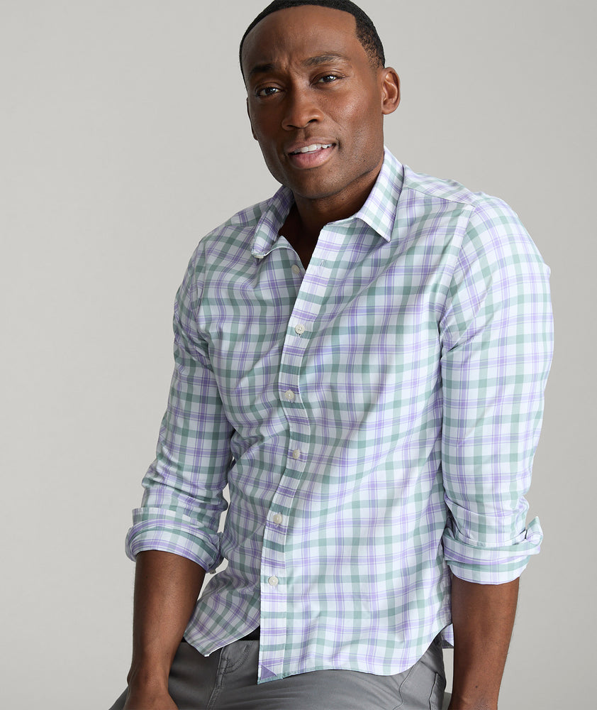 Model is wearing UNTUCKit Winwood performance shirt in purple. 