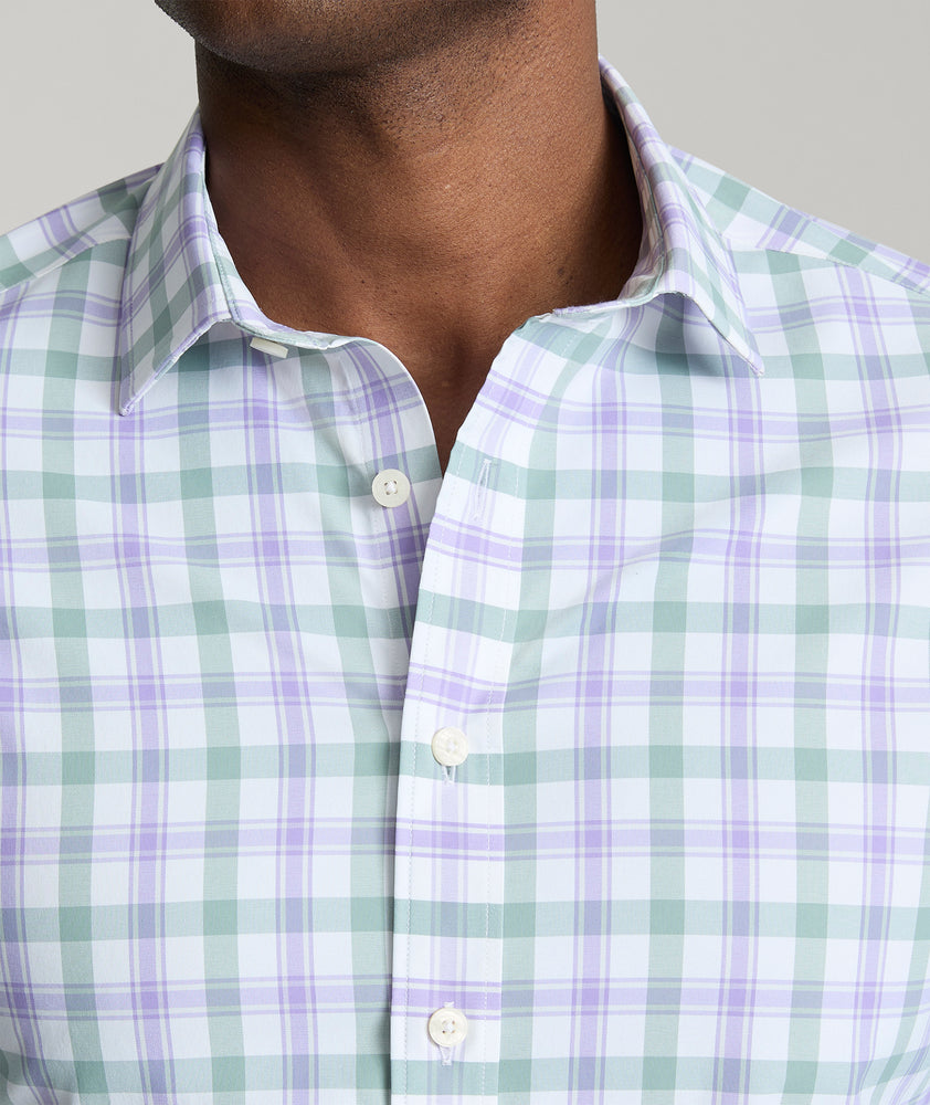 Model is wearing UNTUCKit Winwood performance shirt in purple. 