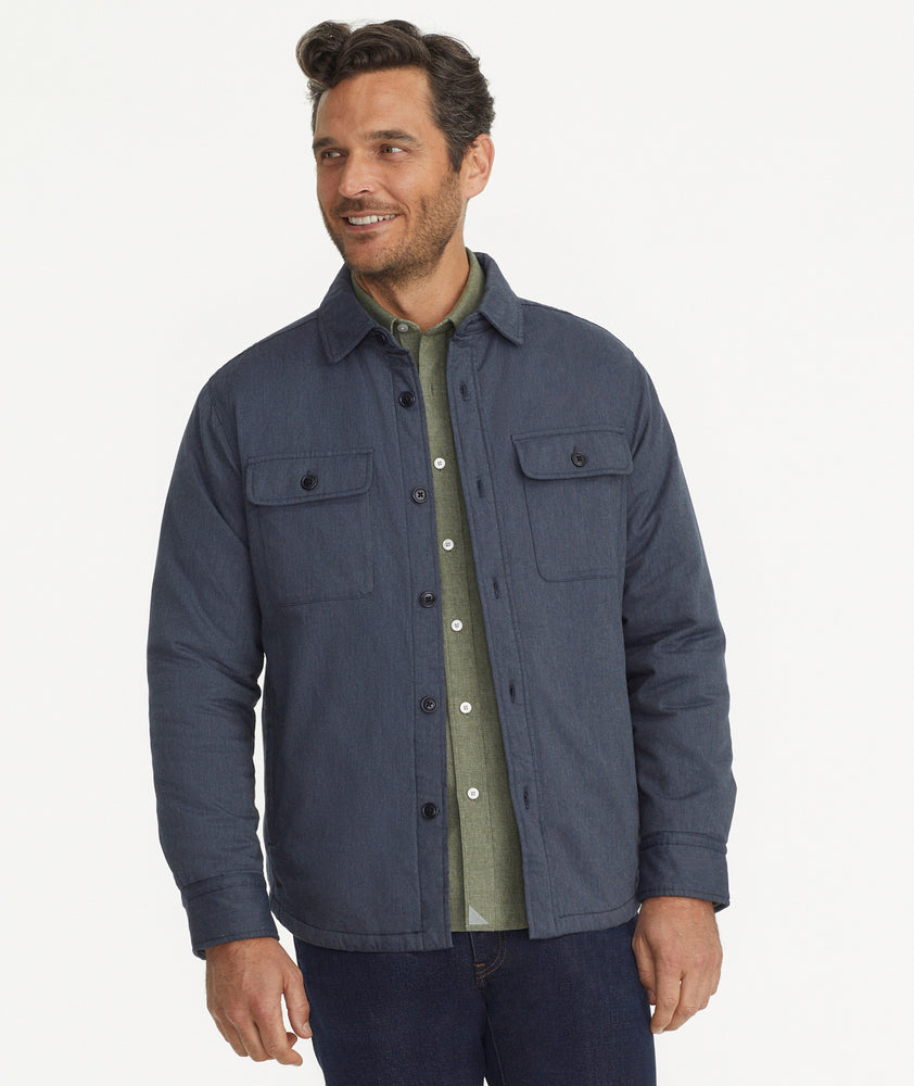 Model is wearing UNTUCKit Ziraldo Jacket in navy. 