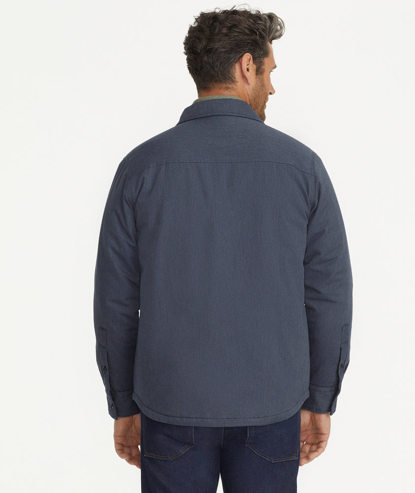 Model is wearing UNTUCKit Ziraldo Jacket in navy. 