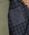 Model is wearing UNTUCKit Ziraldo Jacket in navy. 