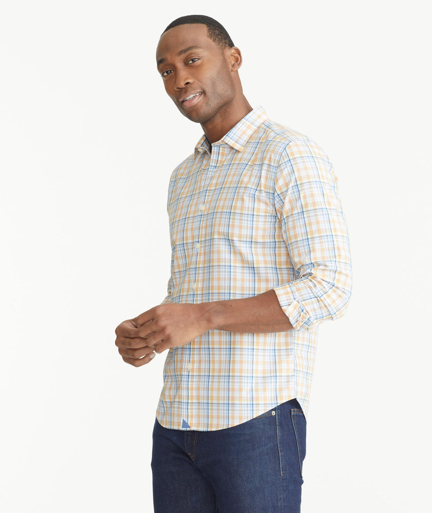 Model is wearing UNTUCKit Orange Plaid Wrinkle-Free Abrusco Shirt.