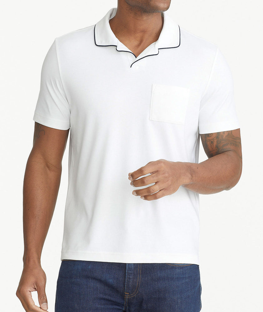 Model is wearing UNTUCKit White Tipped Johnny Collar Polo.