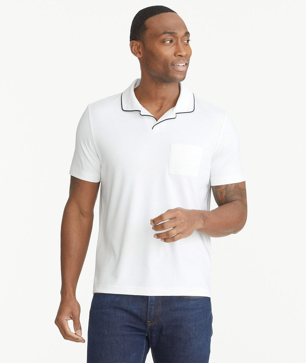 Model is wearing UNTUCKit White Tipped Johnny Collar Polo.