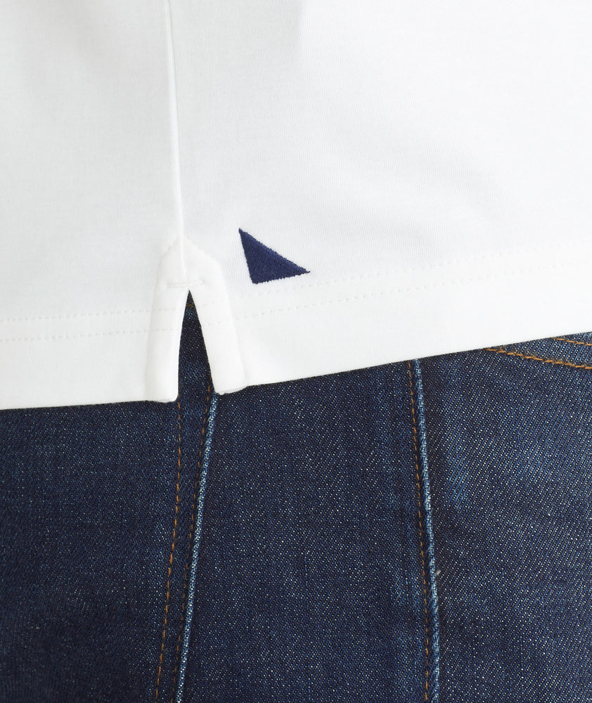 Model is wearing UNTUCKit White Tipped Johnny Collar Polo.
