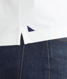 Model is wearing UNTUCKit White Tipped Johnny Collar Polo.