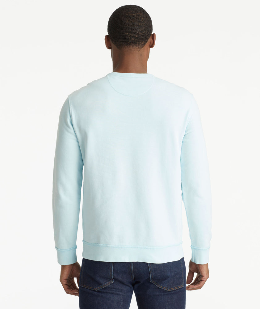 Model wearing an UNTUCKit Bright Blue Mineral Dye Sweatshirt