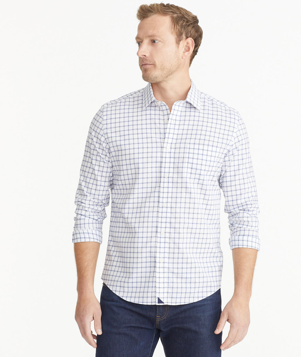 Model wearing an UNTUCKit Blue Wrinkle-Free Barsol Shirt.