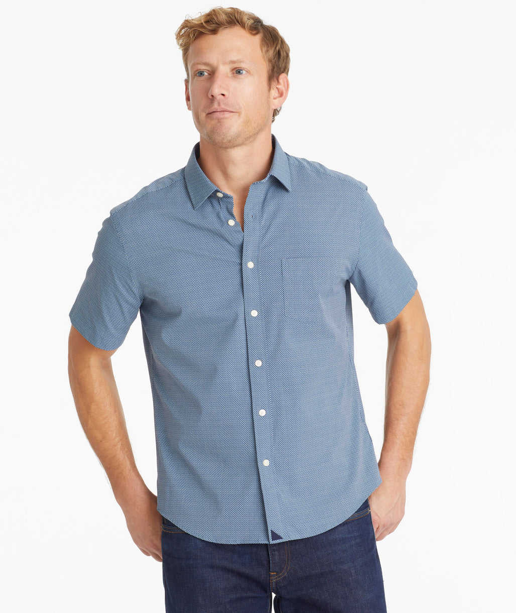 Model wearing an UNTUCKit Dark Blue Wrinkle-Free Performance Short Sleeve Benham Shirt