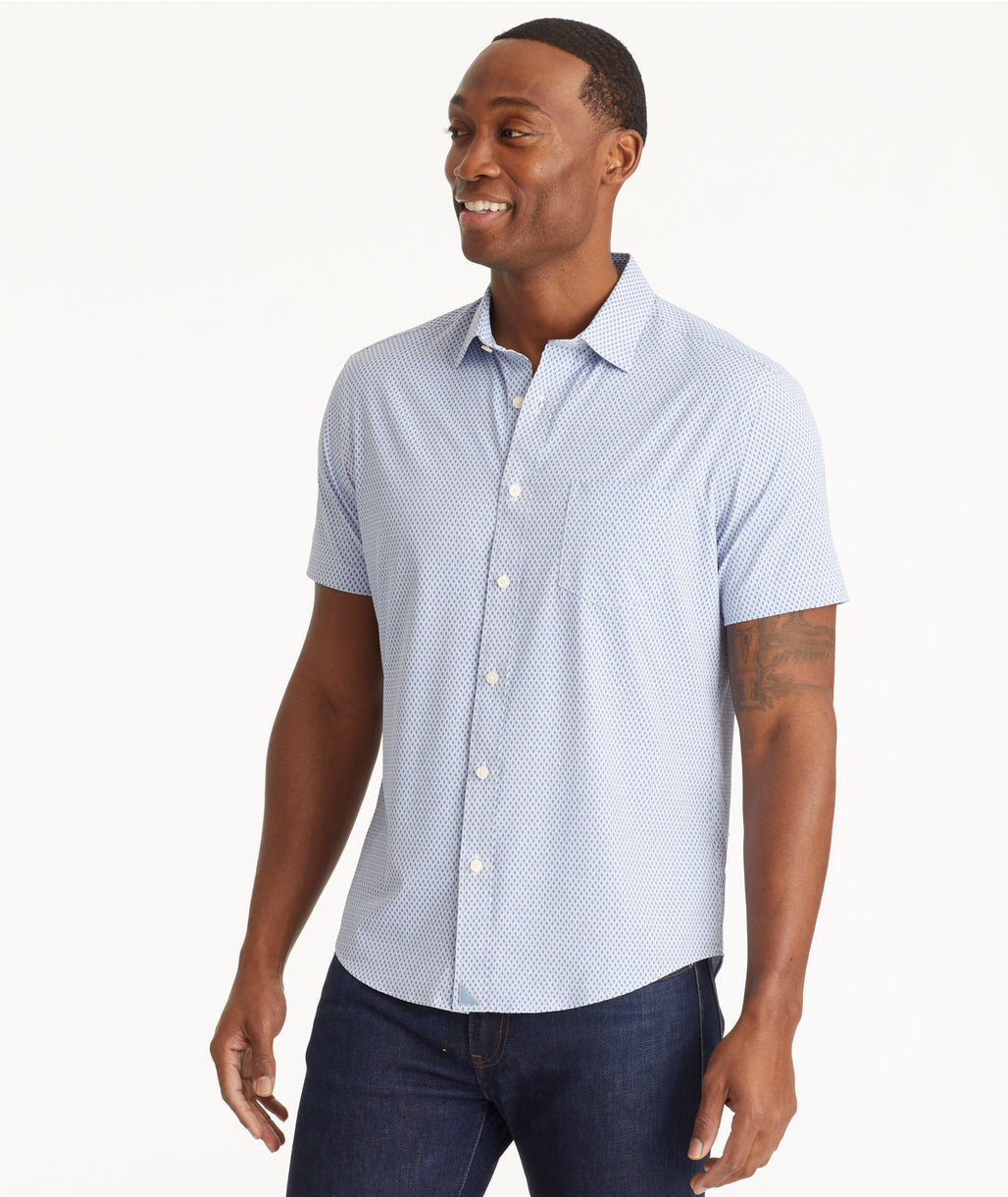 Model wearing an UNTUCKit Light Blue Wrinkle-Free Performance Short-Sleeve Borgo Shirt