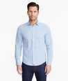 Model wearing a Mid Blue Wrinkle-Free Performance+ Breganze Shirt