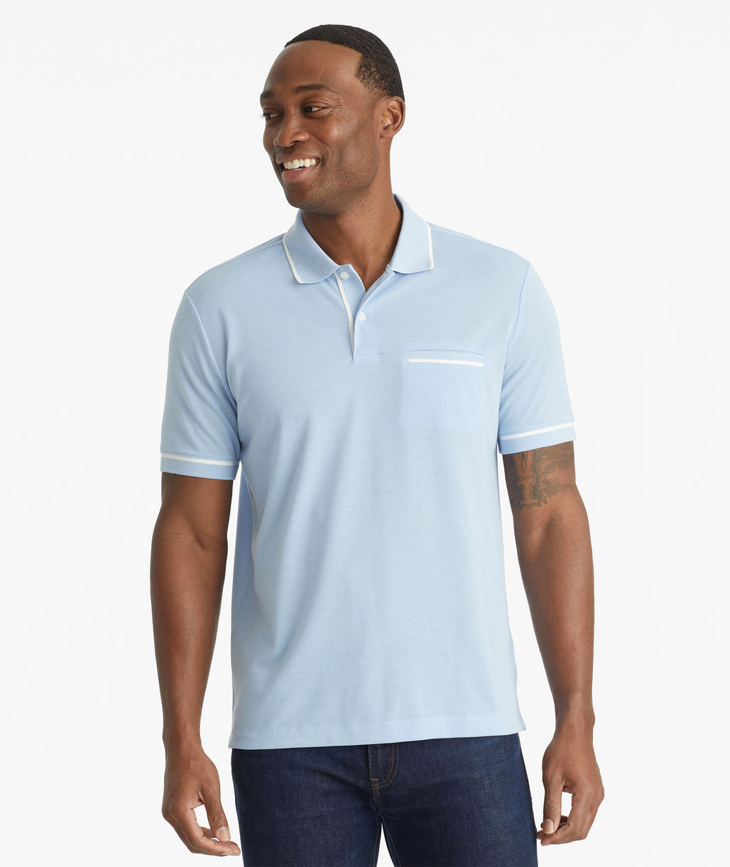 Model wearing an UNTUCKit Blue No Sweat Polo with Tipping