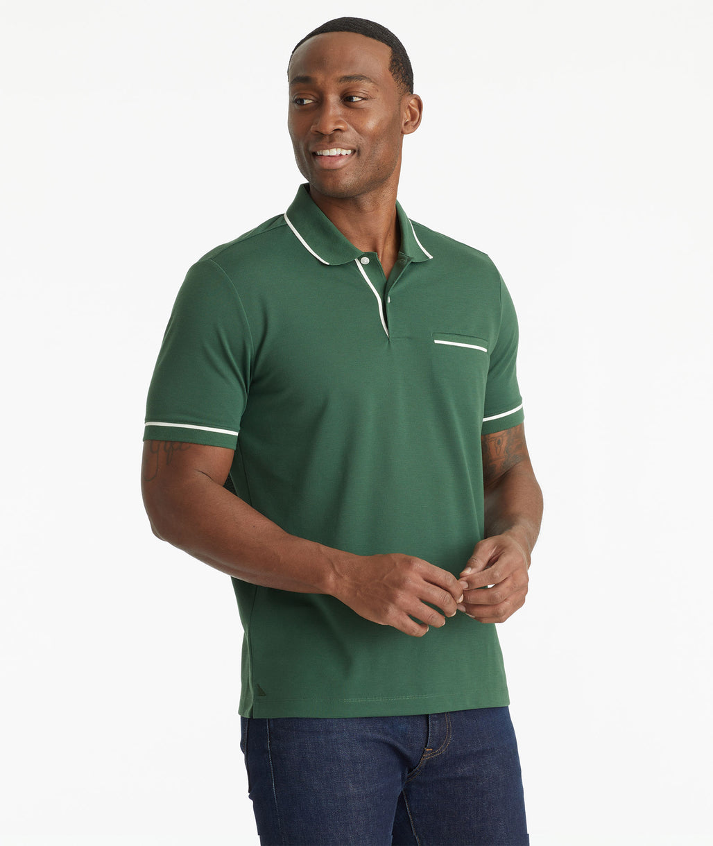 Model wearing an UNTUCKit Dark Green No Sweat Polo with Tipping