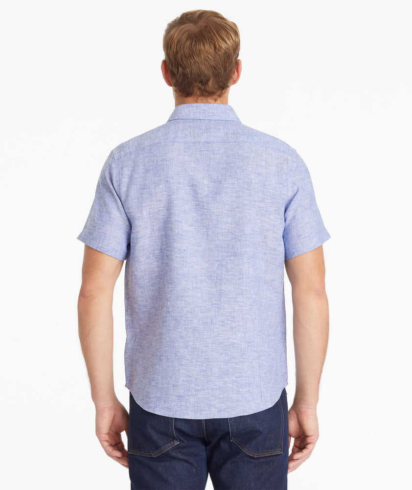 Model wearing an UNTUCKit Blue Wrinkle-Resistant Linen Short Sleeve Cameron Shirt