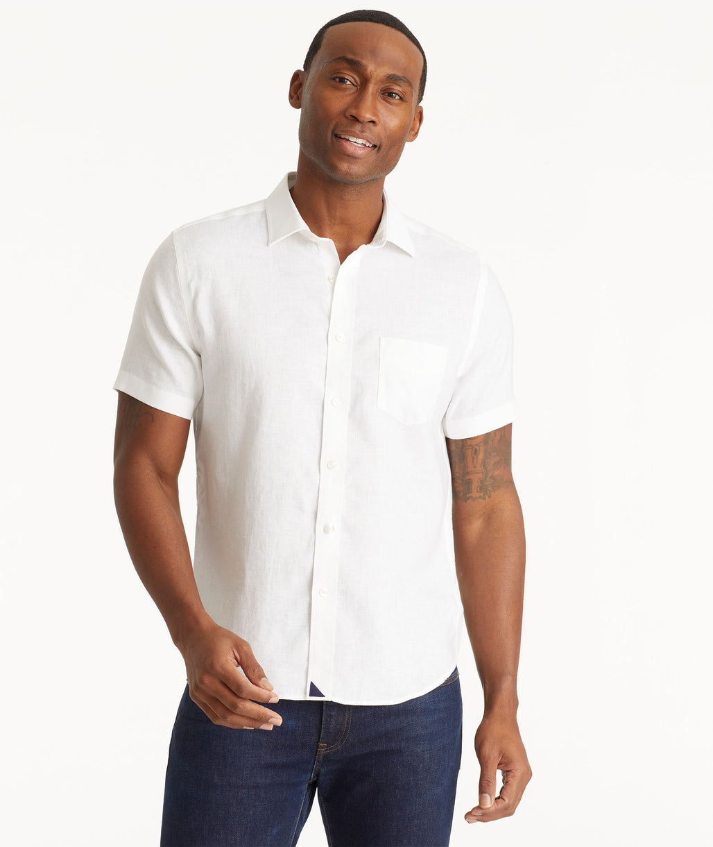 Model wearing an UNTUCKit Bright White Wrinkle-Resistant Linen Short-Sleeve Cameron Shirt