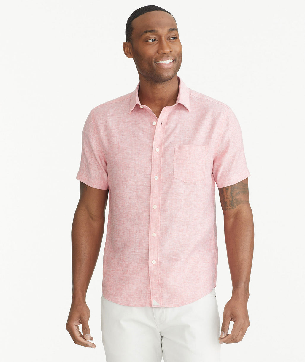 Model is wearing UNTUCKit red Wrinkle-Resistant Linen Short-Sleeve Cameron Shirt