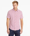 Model wearing an UNTUCKit Light Red Wrinkle-Free Performance Short-Sleeve Chaddsford Shirt