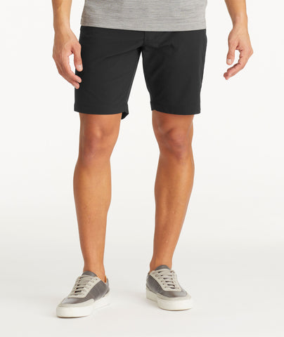 Model wearing UNTUCKit Black Traveler Shorts
