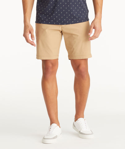 Model wearing UNTUCKit Tan Traveler Shorts