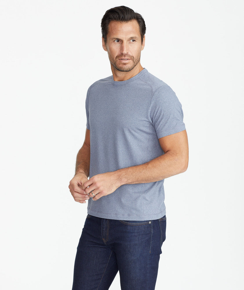 Model wearing a Blue Performance Tee