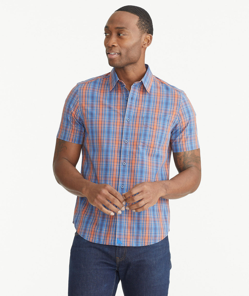 Model is wearing UNTUCKit Colorful Cotton Short-Sleeve Plaid Shirt.