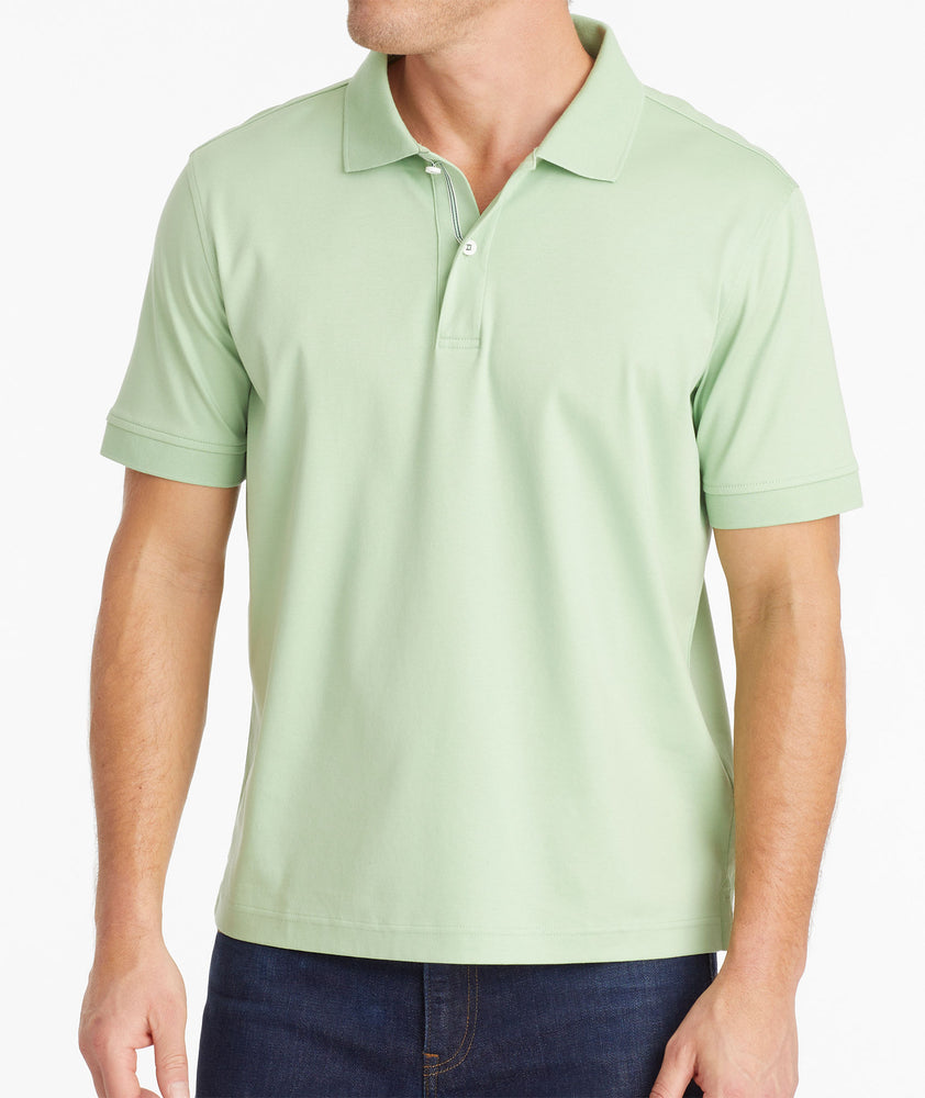 Model wearing an UNTUCKit Quiet Green Wrinkle-Free Damaschino Polo