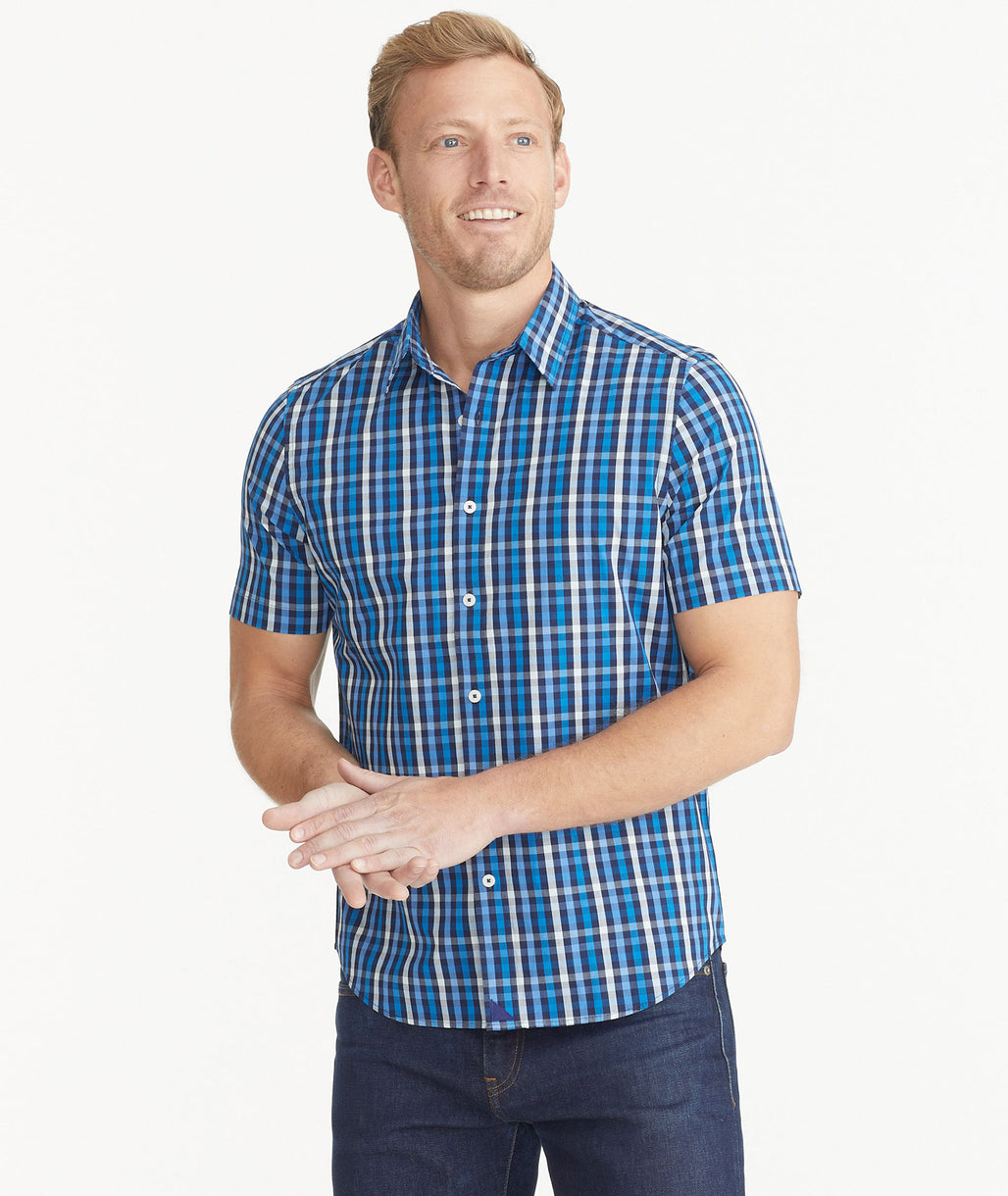 Model is wearing UNTUCKit Dark Blue Cotton Short-Sleeve Check Shirt.