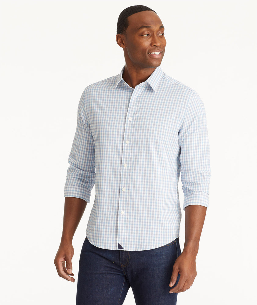 Model wearing an UNTUCKit Light Blue Wrinkle-Free Performance Duras Shirt