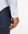 Model wearing an UNTUCKit Light Blue Wrinkle-Free Performance Duras Shirt