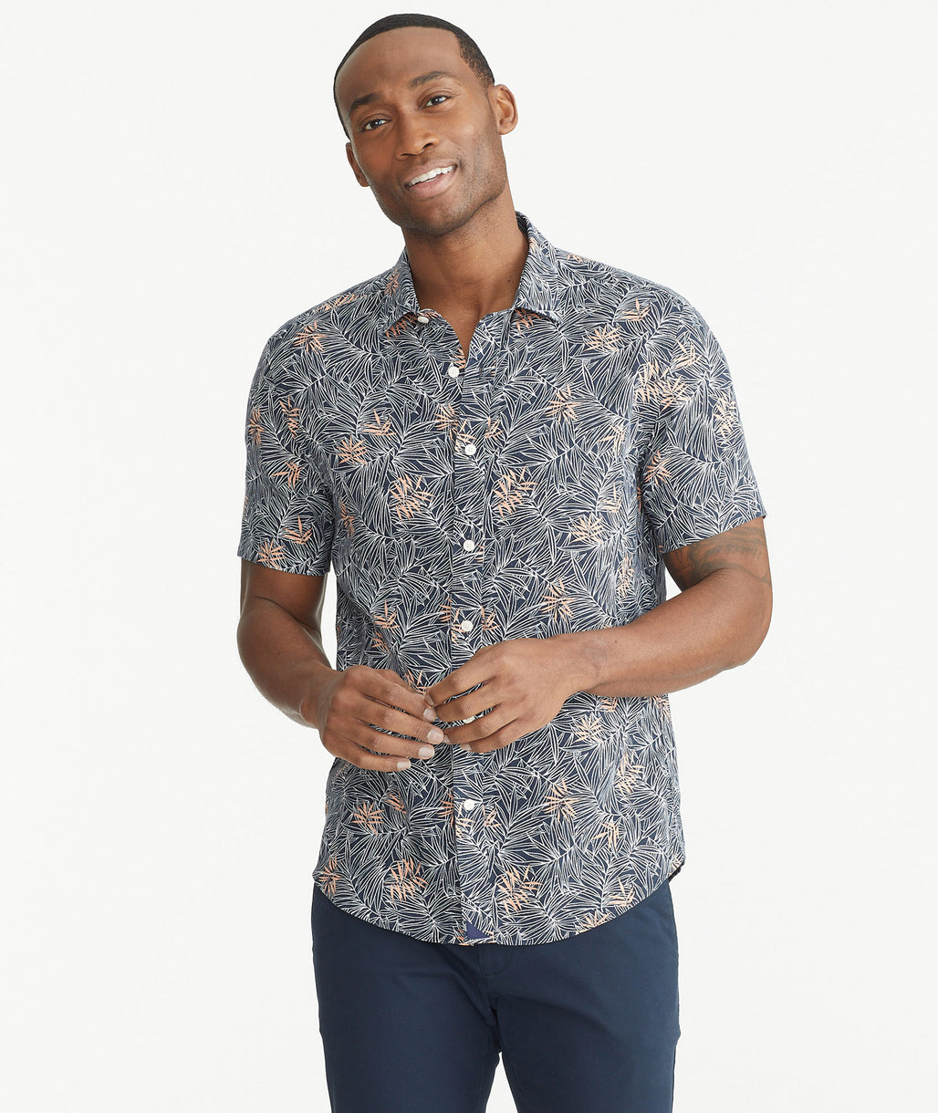 Model is wearing UNTUCKit Navy and Pink Linen Short-Sleeve Durize Shirt