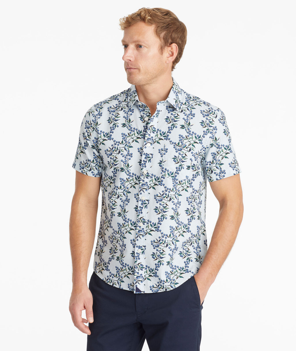 Model wearing an UNTUCKit Light Blue Cotton Printed Short-Sleeve Eloro Shirt