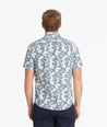 Model wearing an UNTUCKit Light Blue Cotton Printed Short-Sleeve Eloro Shirt