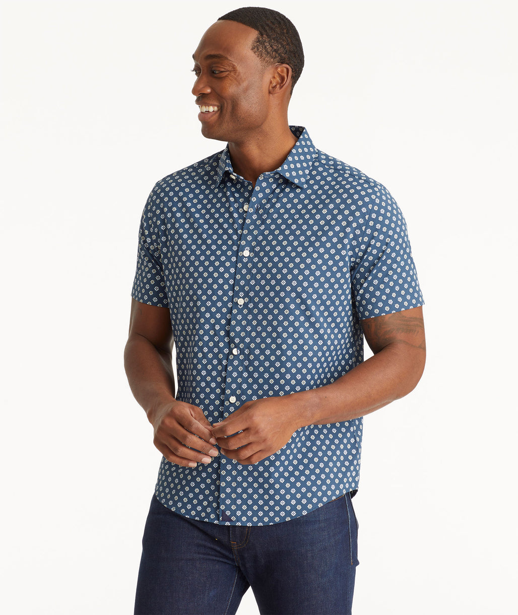 Model wearing an UNTUCKit Navy Wrinkle-Free Performance Short-Sleeve Flores Shirt