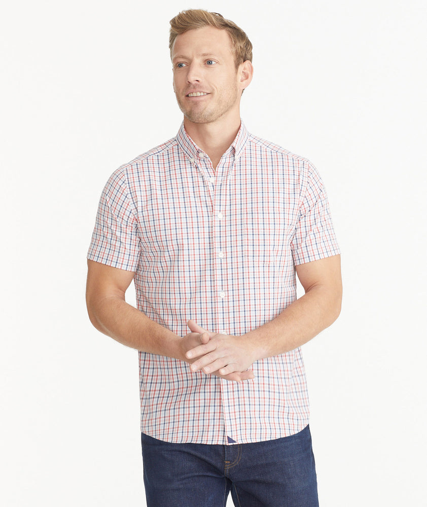 Model is wearing Red White & Blue Check Wrinkle-Free Performance Short-Sleeve Gaten Shirt.