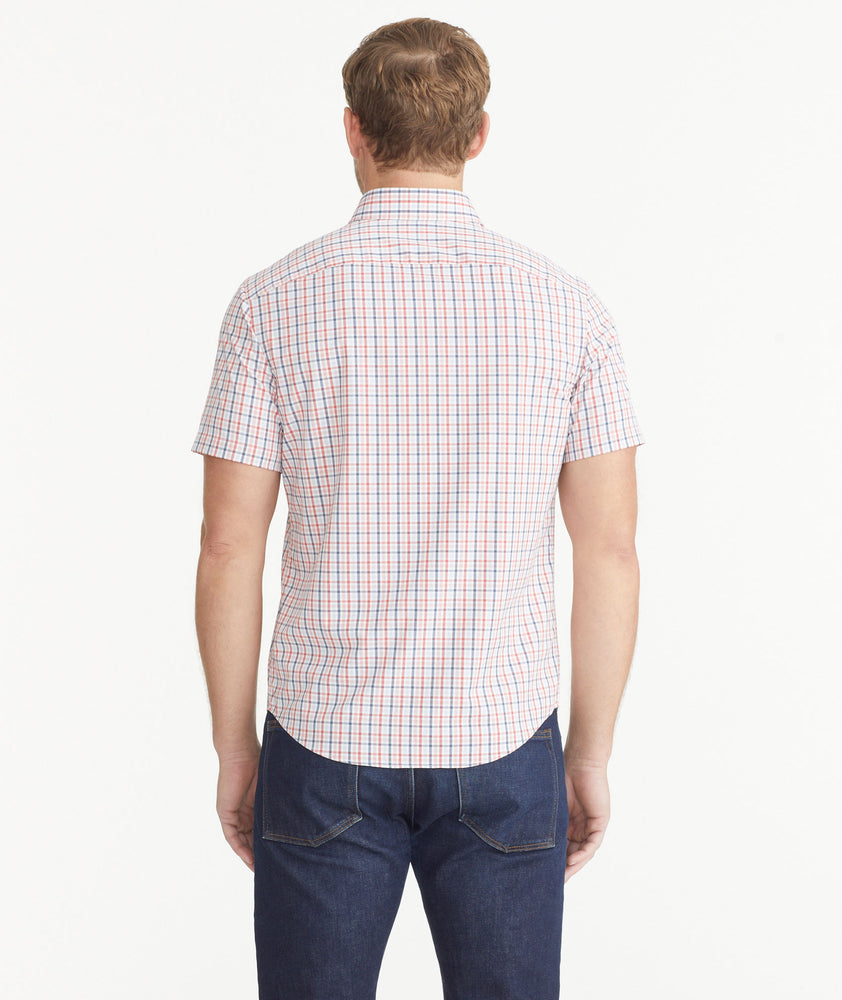Model is wearing Red White & Blue Check Wrinkle-Free Performance Short-Sleeve Gaten Shirt.