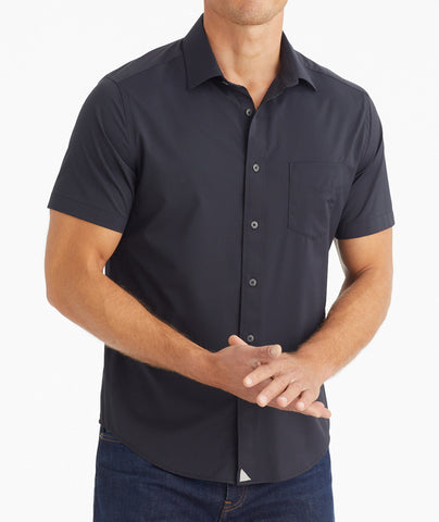 Model wearing an UNTUCKit Black Wrinkle-Free Performance Short Sleeve Gironde Shirt