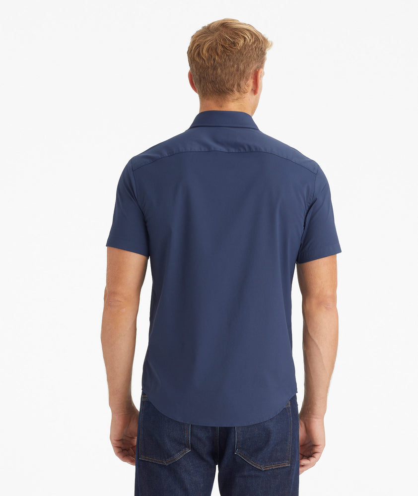 Model wearing an UNTUCKit Navy Wrinkle-Free Performance Short Sleeve Gironde Shirt