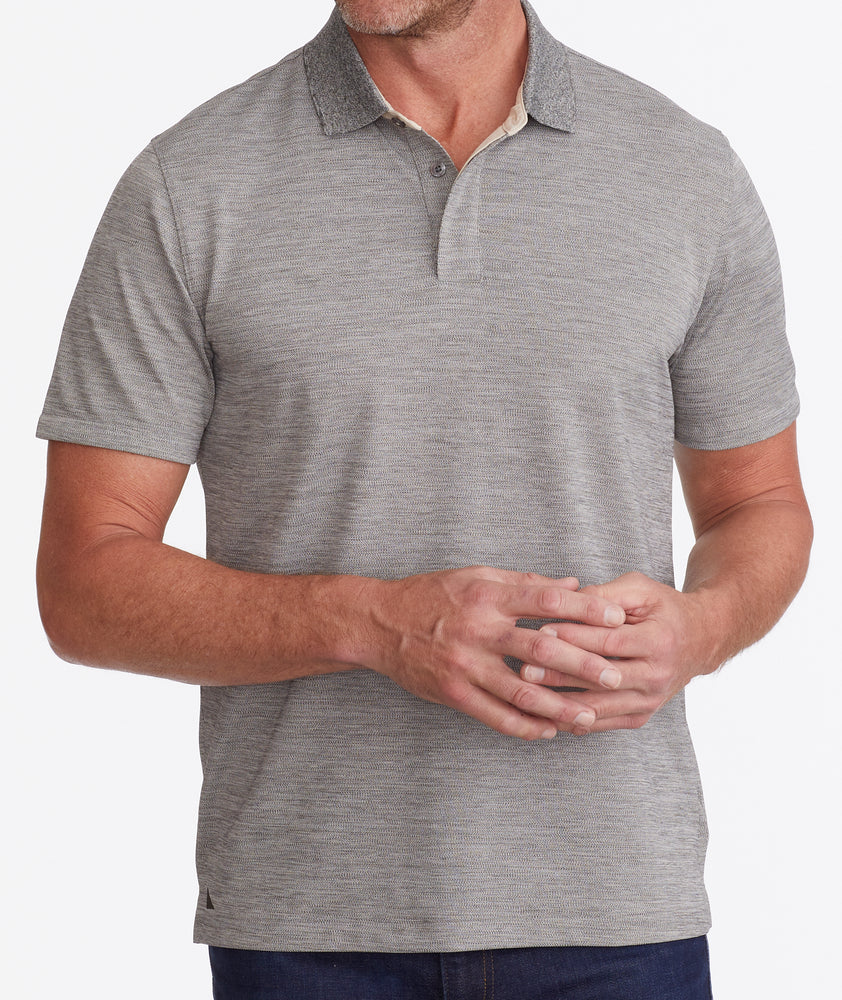 Model wearing a Tan No Sweat Heathered Polo