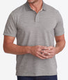 Model wearing a Tan No Sweat Heathered Polo