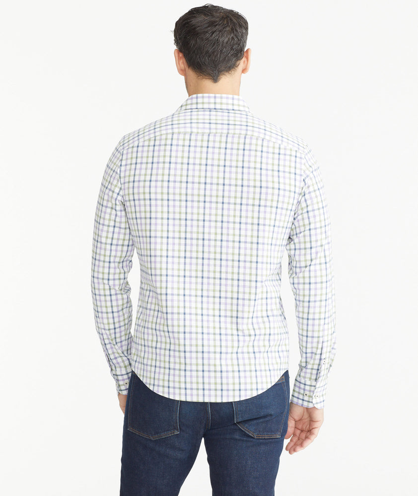 Model is wearing UNTUCKit Lilac & Olive Check Wrinkle-Free Performance Hawkins Shirt.