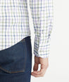 Model is wearing UNTUCKit Lilac & Olive Check Wrinkle-Free Performance Hawkins Shirt.