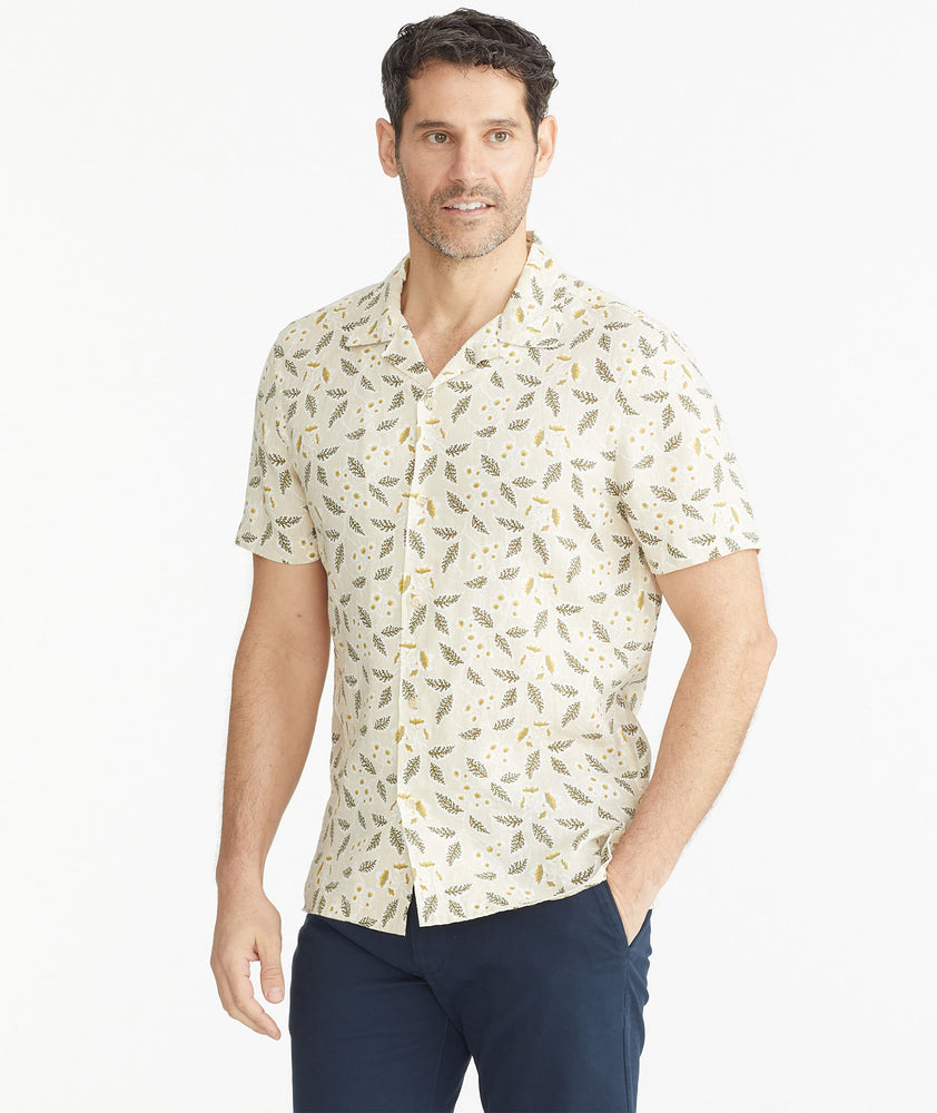 Model is wearing UNTUCKit Tan Floral Linen Short-Sleeve Heaton Shirt.