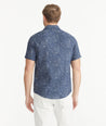 Model is wearing UNTUCKit Navy Butterfly Print Linen Short-Sleeve Hopper Shirt