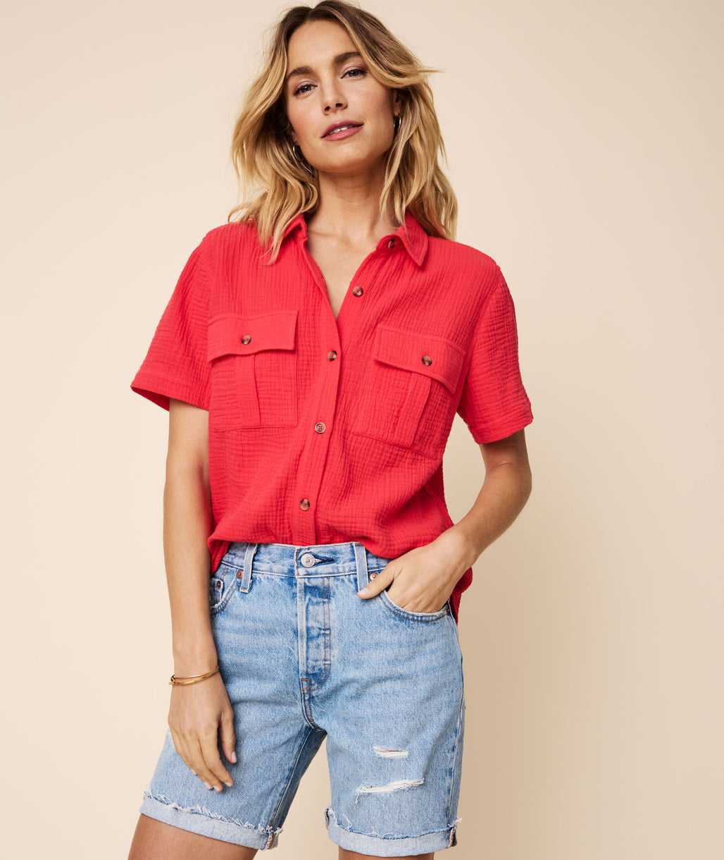 Model is wearing UNTUCKit Red Short-sleeve Cotton Gauze Jodi Shirt.