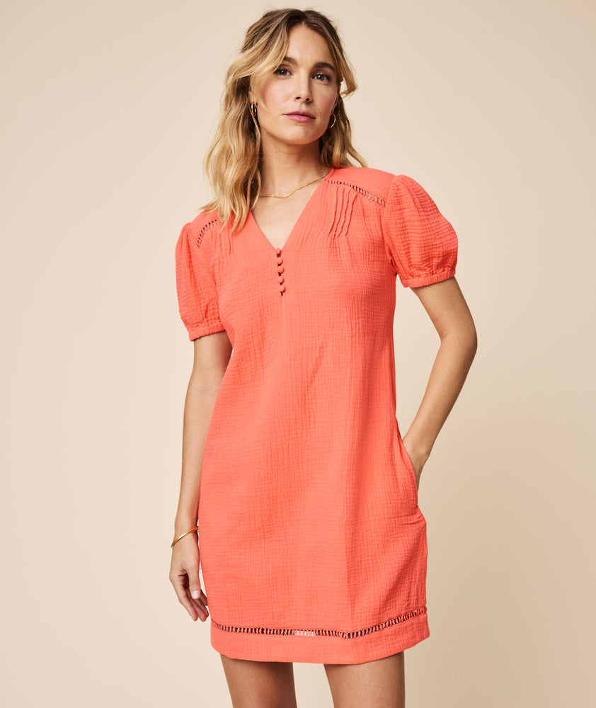 Model is wearing Solid Orange Cotton Gauze Short-sleeve Kasey Shift Dress.