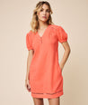 Model is wearing Solid Orange Cotton Gauze Short-sleeve Kasey Shift Dress.