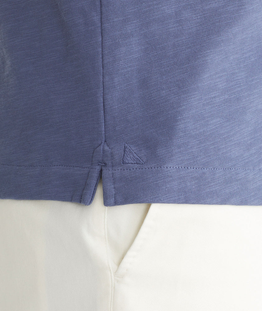 Model is wearing UNTUCKit Blue Indigo Cotton Slub Resort Shirt.
